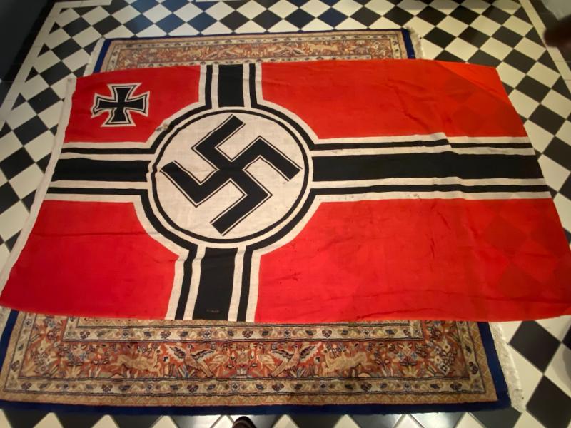 A PROPER USED AND FLOWN NAVY MARKED REICHSKRIEGSFLAG.