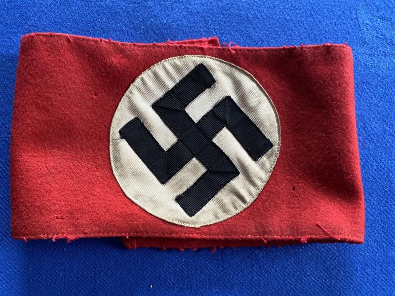 AN ALL WOOL NSDAP PARTY ARMBAND COMPLETE WITH RZM TAG.