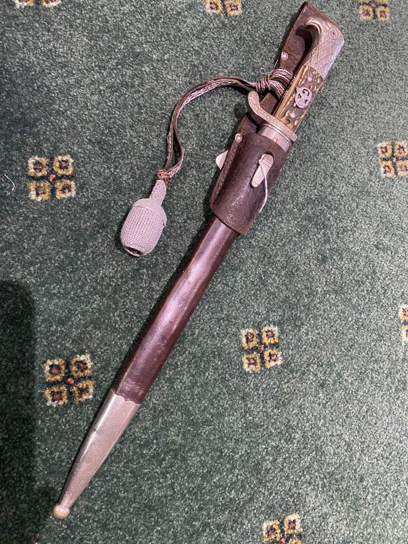 A  LONG RURAL THIRD REICH POLICE BAYONET WITH BROWN SCABBARD AND FROG.