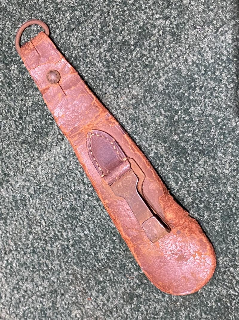 BROWN LEATHER TEAR DROP SWORD HANGER.