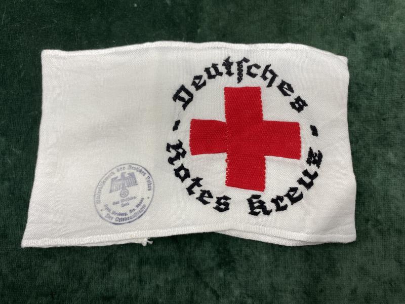 THIRD REICH RED CROSS  MEMBERS ARMBAND WITH ISSUE STAMP.