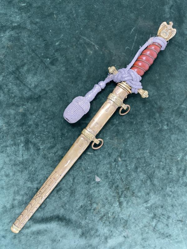 EARLY ALCOSO NAVY DAGGER WITH KNOT, ORANGE GRIP AND SAILING SHIP BLADE.