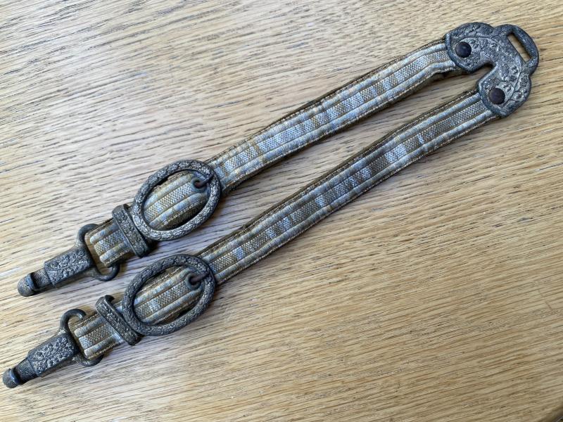 A RARE SET OF ‘HORSE SHOE TOP ’ARMY DAGGER HANGERS.
