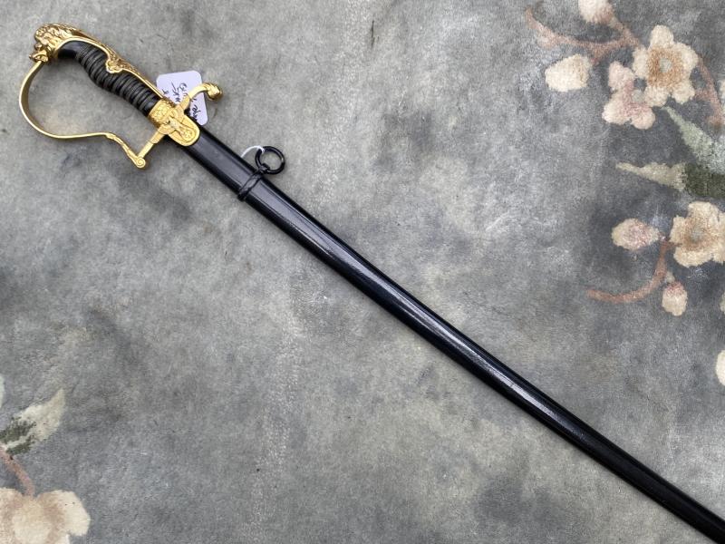A BEAUTIFUL LIONS HEAD SWORD IN GILDED ALUMINIUM BY CLEM & JUNG.