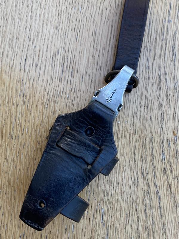 AN ORIGINAL- MARKED BLACK SS VERTICAL DAGGER HANGER.