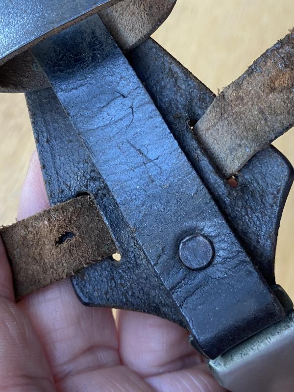 AN ORIGINAL- MARKED BLACK SS VERTICAL DAGGER HANGER.