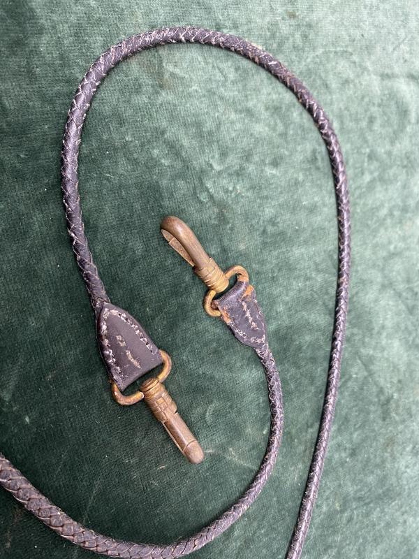 EXTREMELY RARE SET OF ‘DOG LEAD’ LEATHER HANGERS FOR NAVY SWORD.