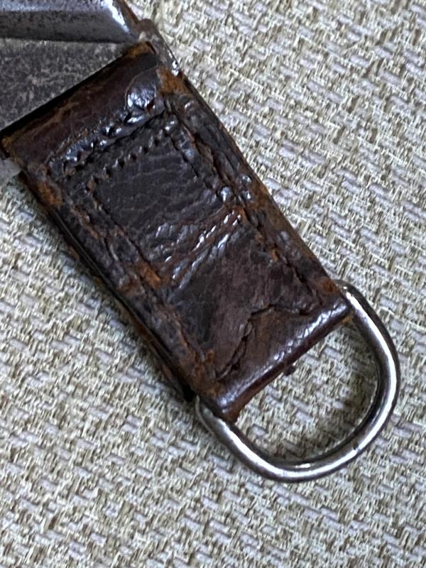 AN UNUSUAL, ORIGINAL HANGER FOR A RAD HEWER.