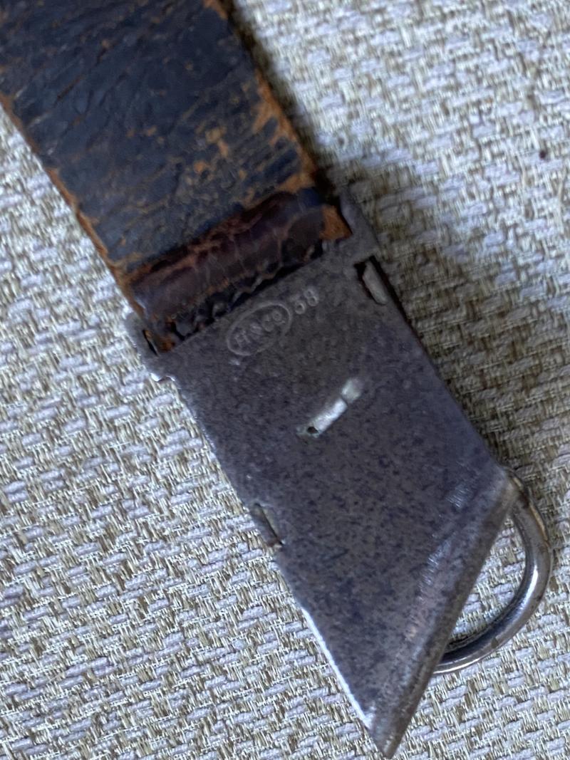 AN UNUSUAL, ORIGINAL HANGER FOR A RAD HEWER.