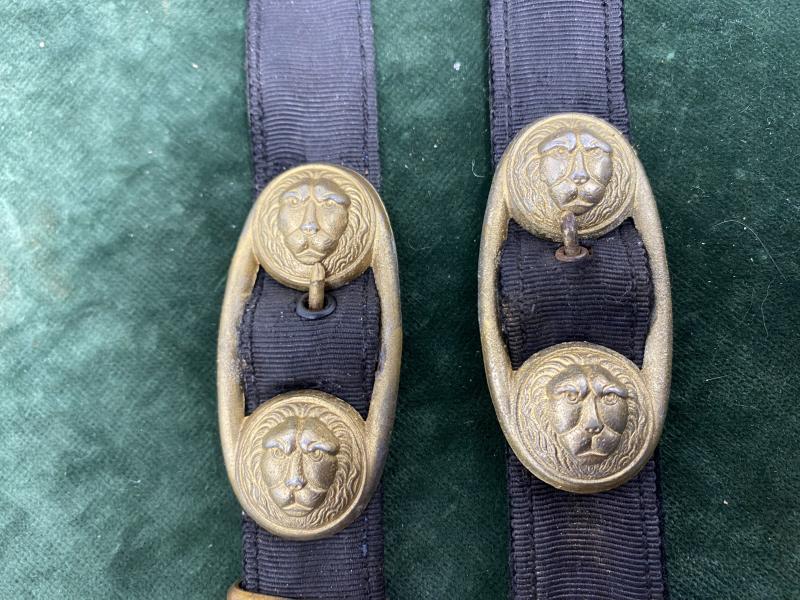 A SET OF MATCHING NAVAL DAGGER HANGERS.
