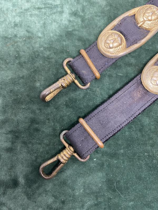 A SET OF MATCHING NAVAL DAGGER HANGERS.