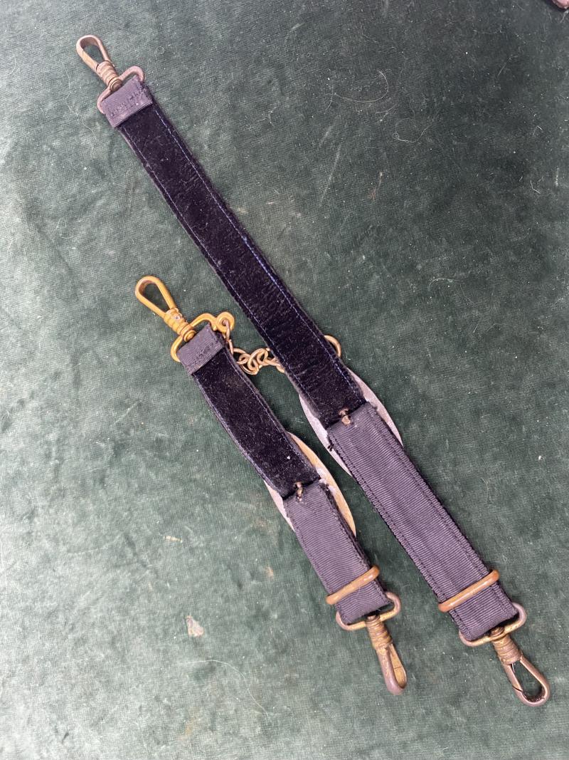 A SET OF MATCHING NAVAL DAGGER HANGERS.