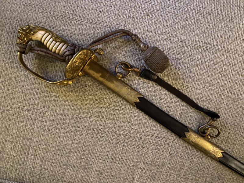 A BEAUTIFUL IMPERIAL NAVAL OFFICERS SWORD BY WK&C WITH ORIGINAL RED/BLACK KNOT.