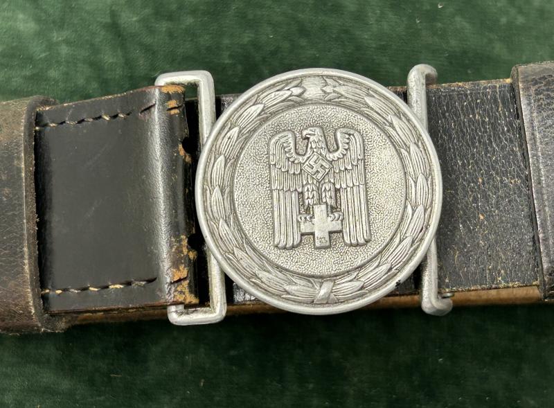 A RARELY FOUND RED CROSS OFFICERS SERVICE BELT AND BUCKLE.