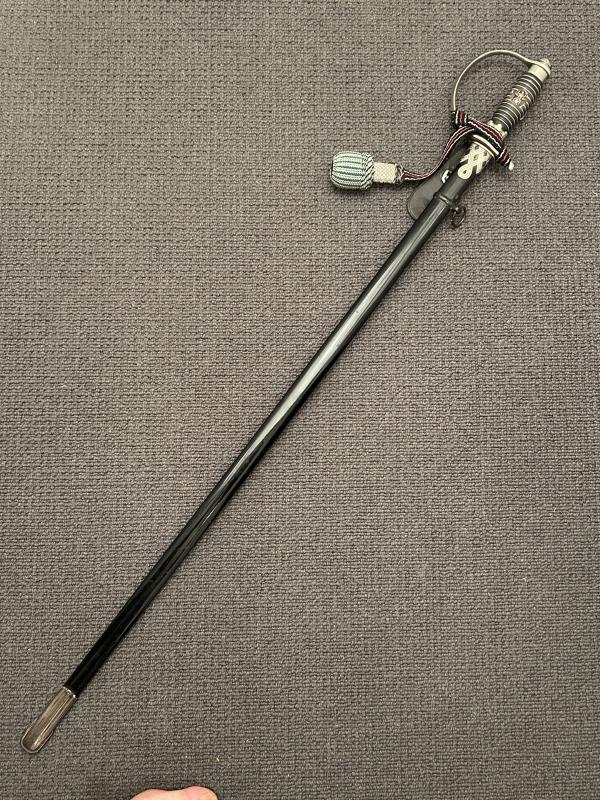 A MINT CONDITIONED POLICE OFFICERS DEGEN WITH SS POMMELL, KNOT & HANGER.