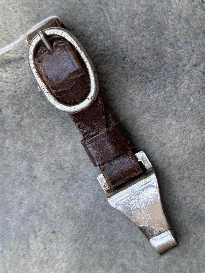 A MOST UNUSUALLY MARKED SA DAGGER HANGER.