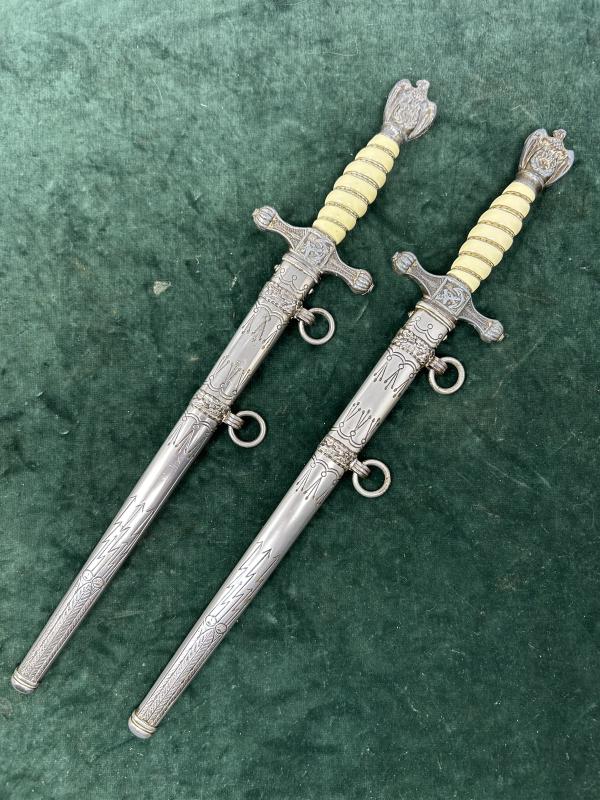 A PAIR OF VERY LATE WAR NAVY DAGGERS BY EICKHORN.