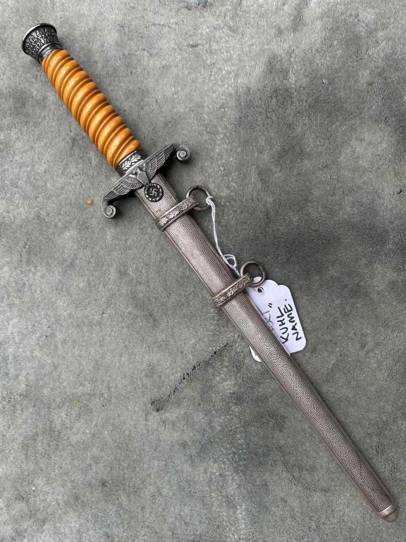 A VERY NICE ARMY OFFICERS DAGGER WITH ORANGE GRIP AND DISTRIBUTOR MARKED BLADE.