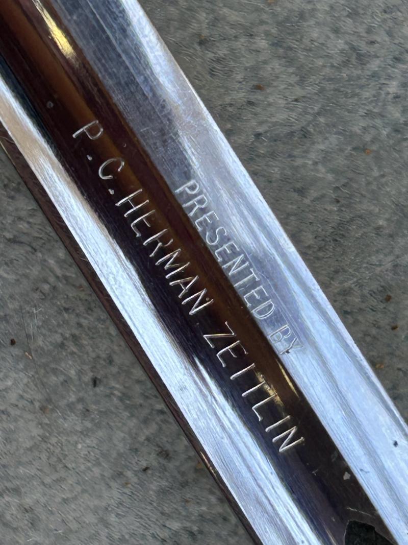 A MOST UNUSUAL THIRD REICH ERA SWORD DEDICATED TO AMERICAN SERVICEMAN IN MEMORIAM.
