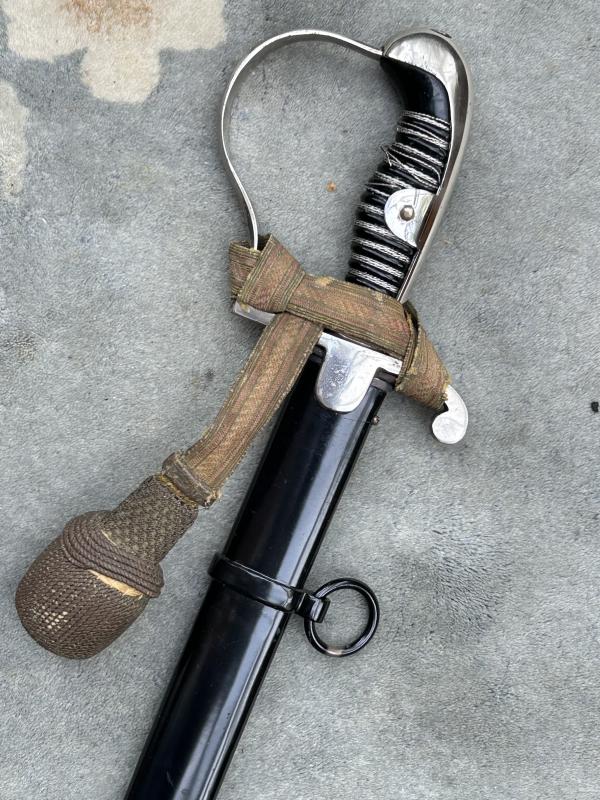 A TRIPLE ETCHED GERMAN DOVE HEAD SWORD BY WEYERSBERG.