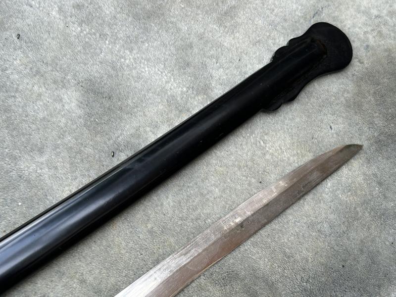 A TRIPLE ETCHED GERMAN DOVE HEAD SWORD BY WEYERSBERG.